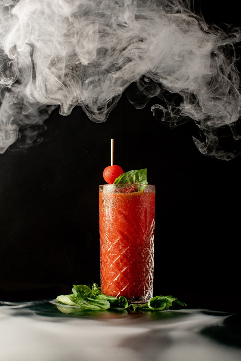 Smoked Bloody Mary Recipe in a Tall Glass With Smoke Rising