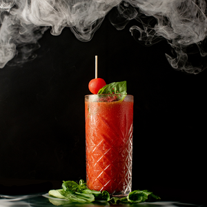 Smoked Bloody Mary Recipe in a Tall Glass With Smoke Rising