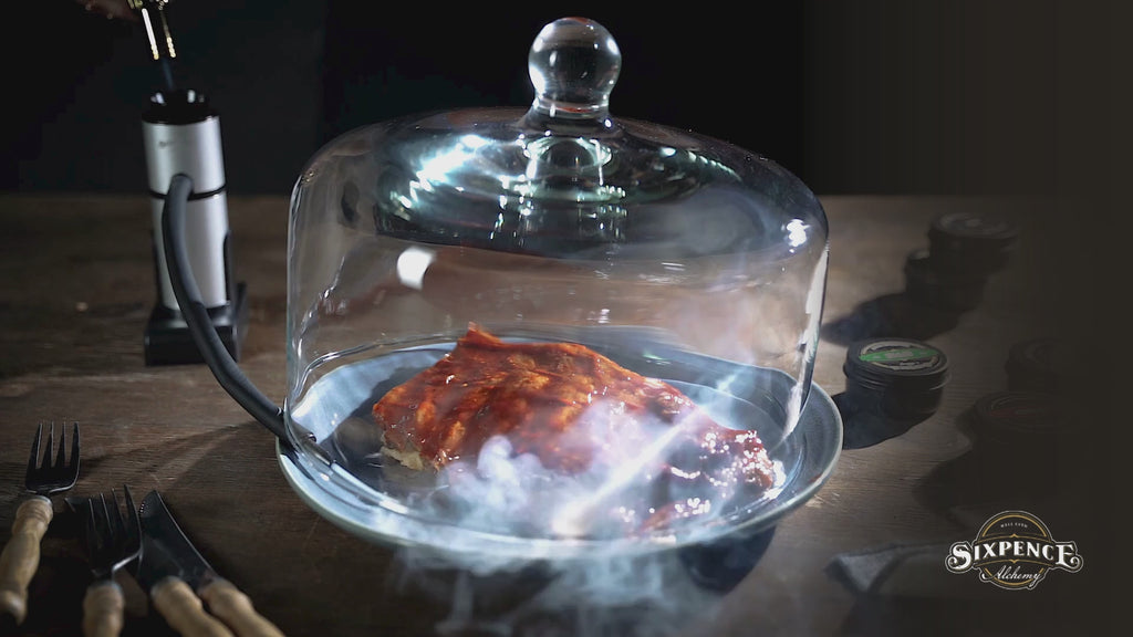 Video demonstrating the Sixpence Alchemy Premium Food & Drink Smoke Infuser adding natural smoke to ribs, smoked tea and a handcrafted cocktail from preparation through to serving.