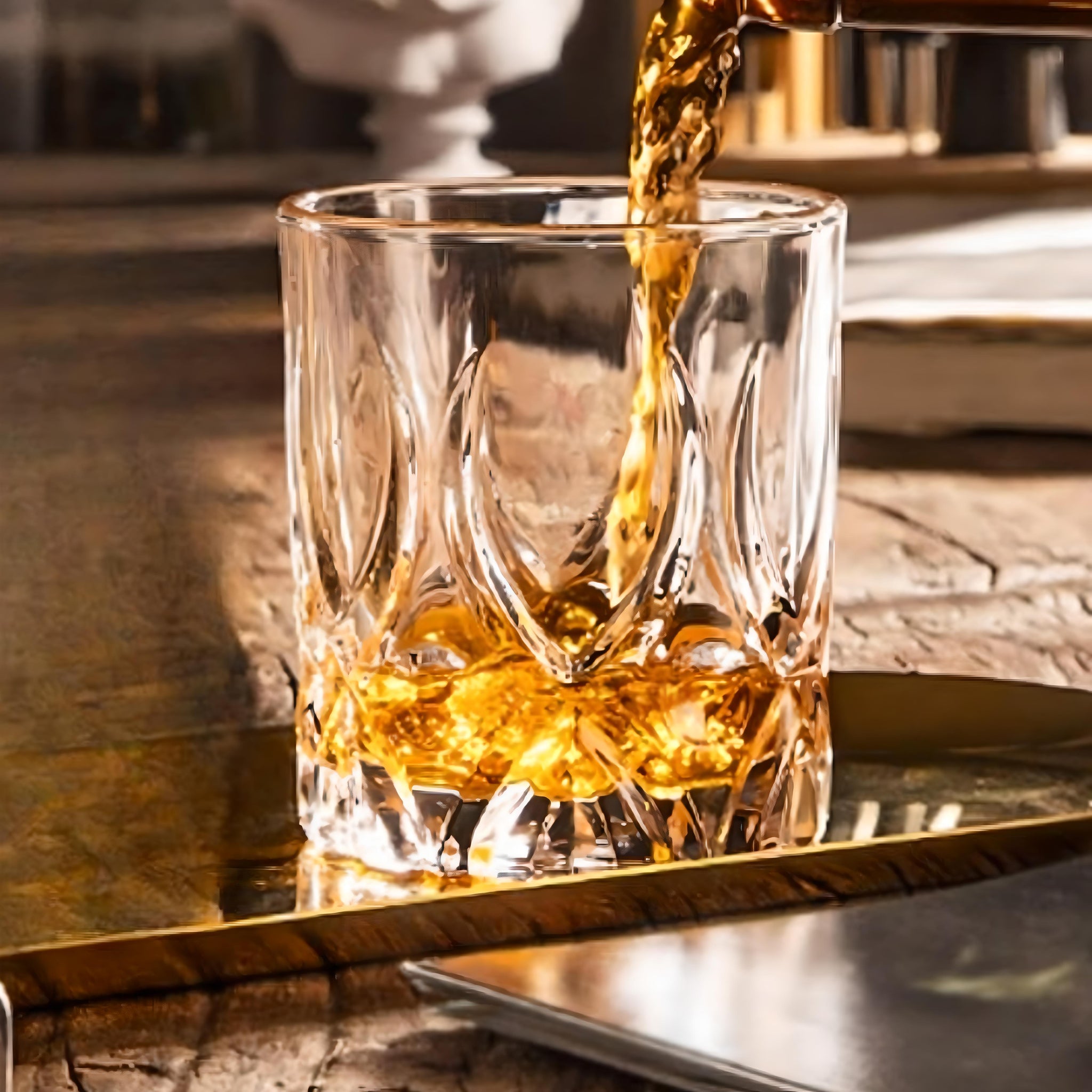 scotch whiskey being poured into Sixpence Alchemy crystal rocks glass